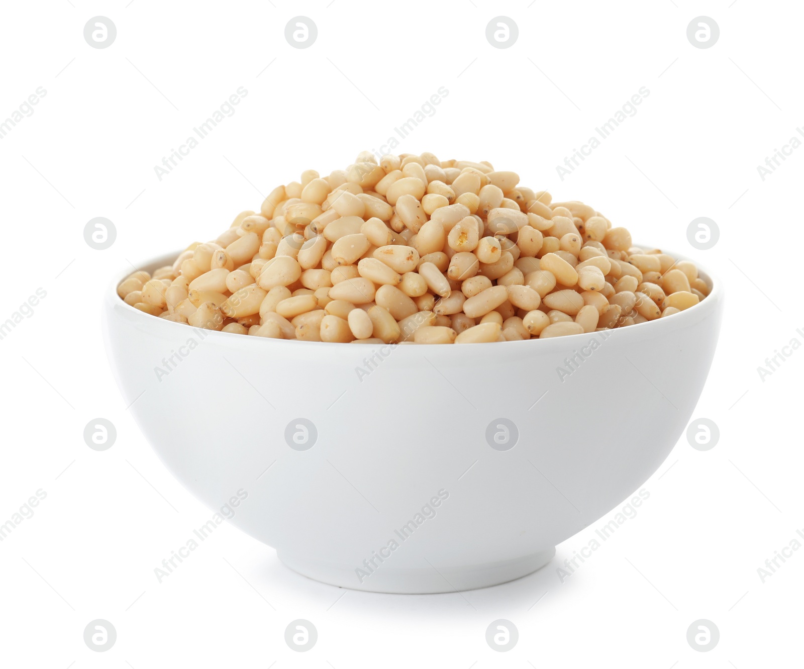 Photo of Bowl with pine nuts on white background