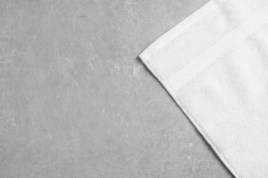 Photo of Soft towel on gray background, top view. Space for text