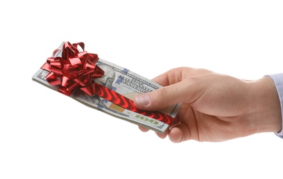 Photo of Man holding stack of dollar bills with bow on white background, closeup