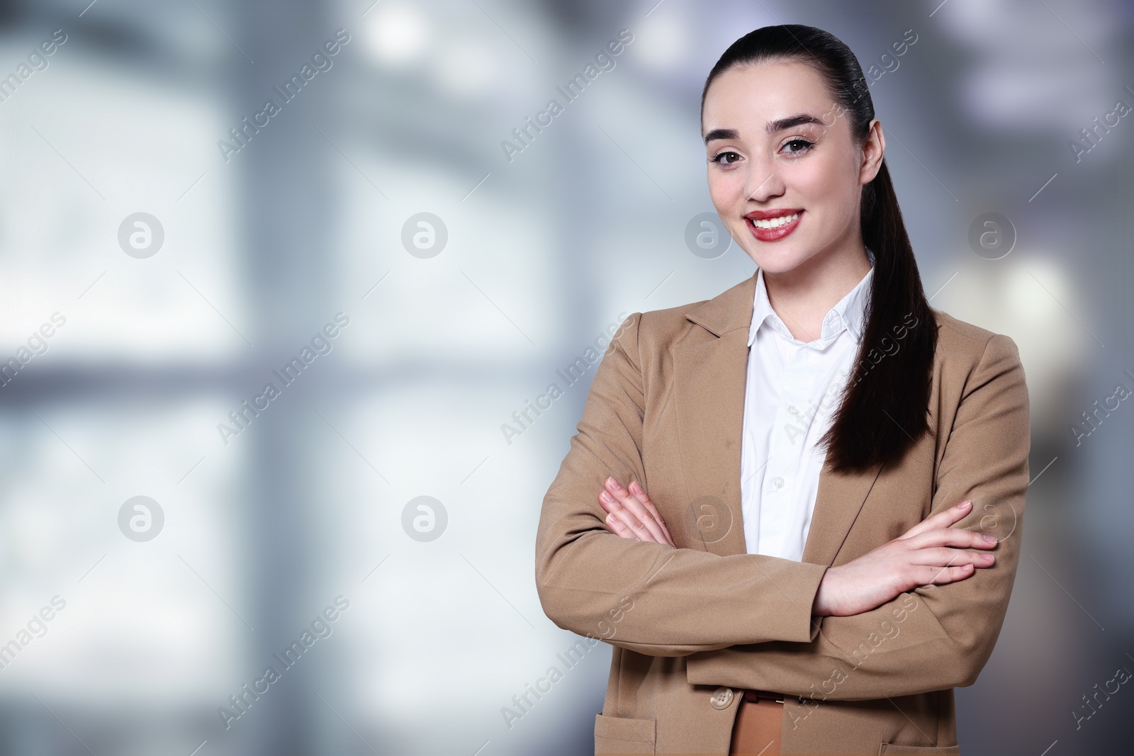 Image of Beautiful real estate agent in office, space for text