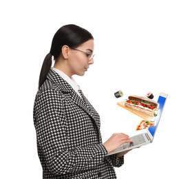 Young woman using laptop for ordering food online on white background. Delivery service during quarantine