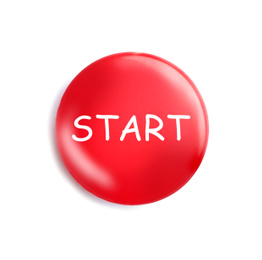 Red magnet with word START on white background, top view