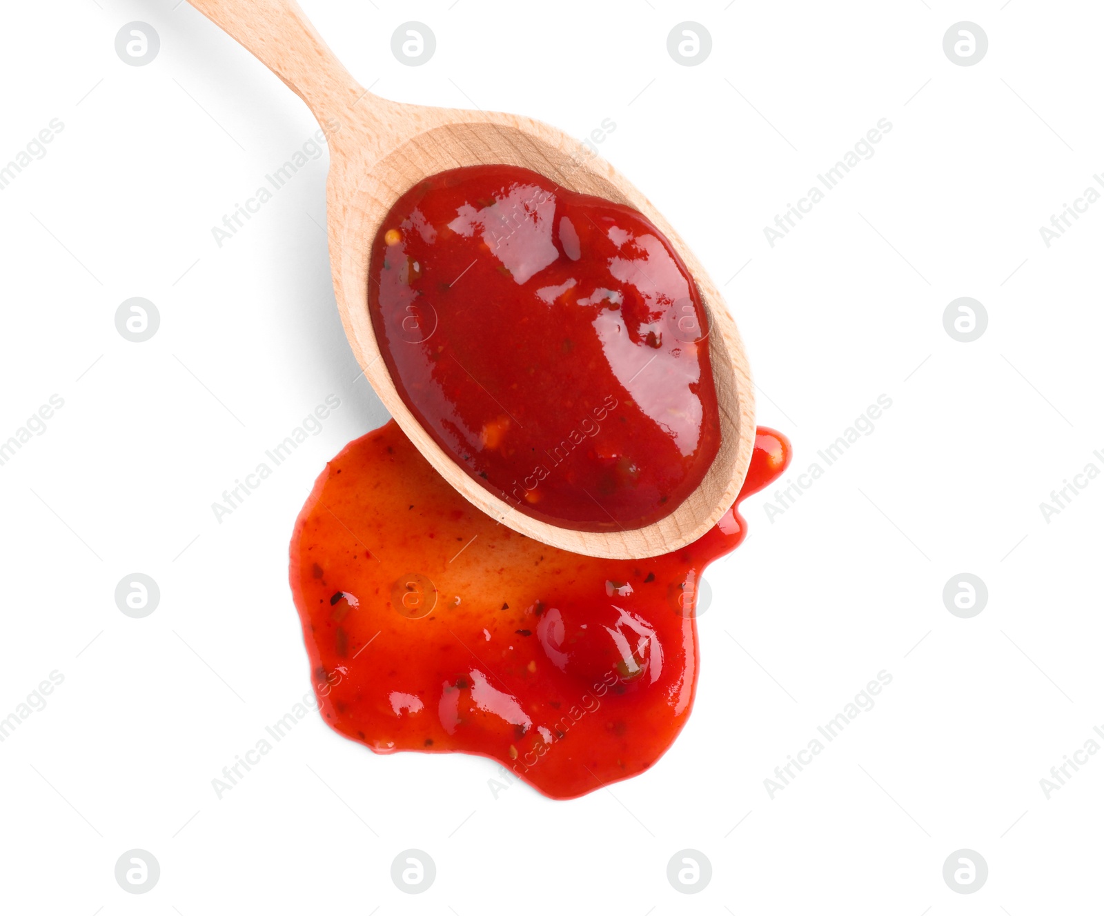 Photo of Wooden spoon and red sauce on white background, top view