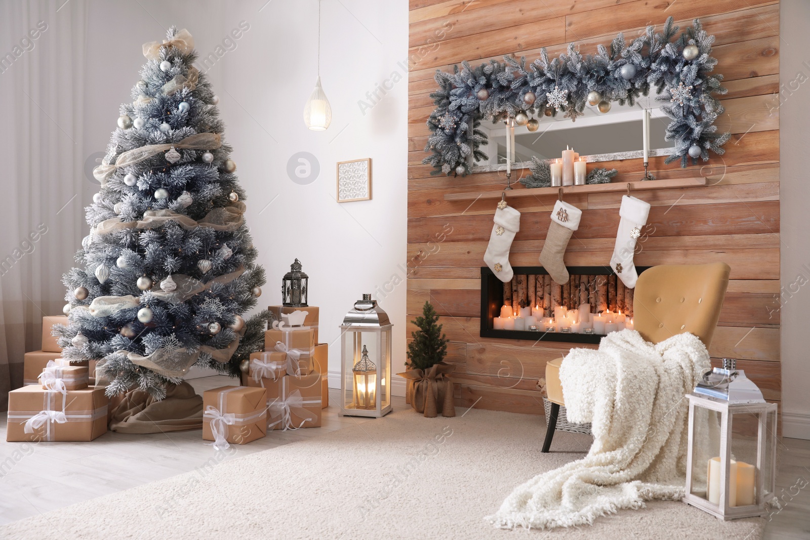 Photo of Festive interior with decorated Christmas tree and fireplace