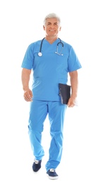 Full length portrait of male doctor in scrubs with clipboard isolated on white. Medical staff