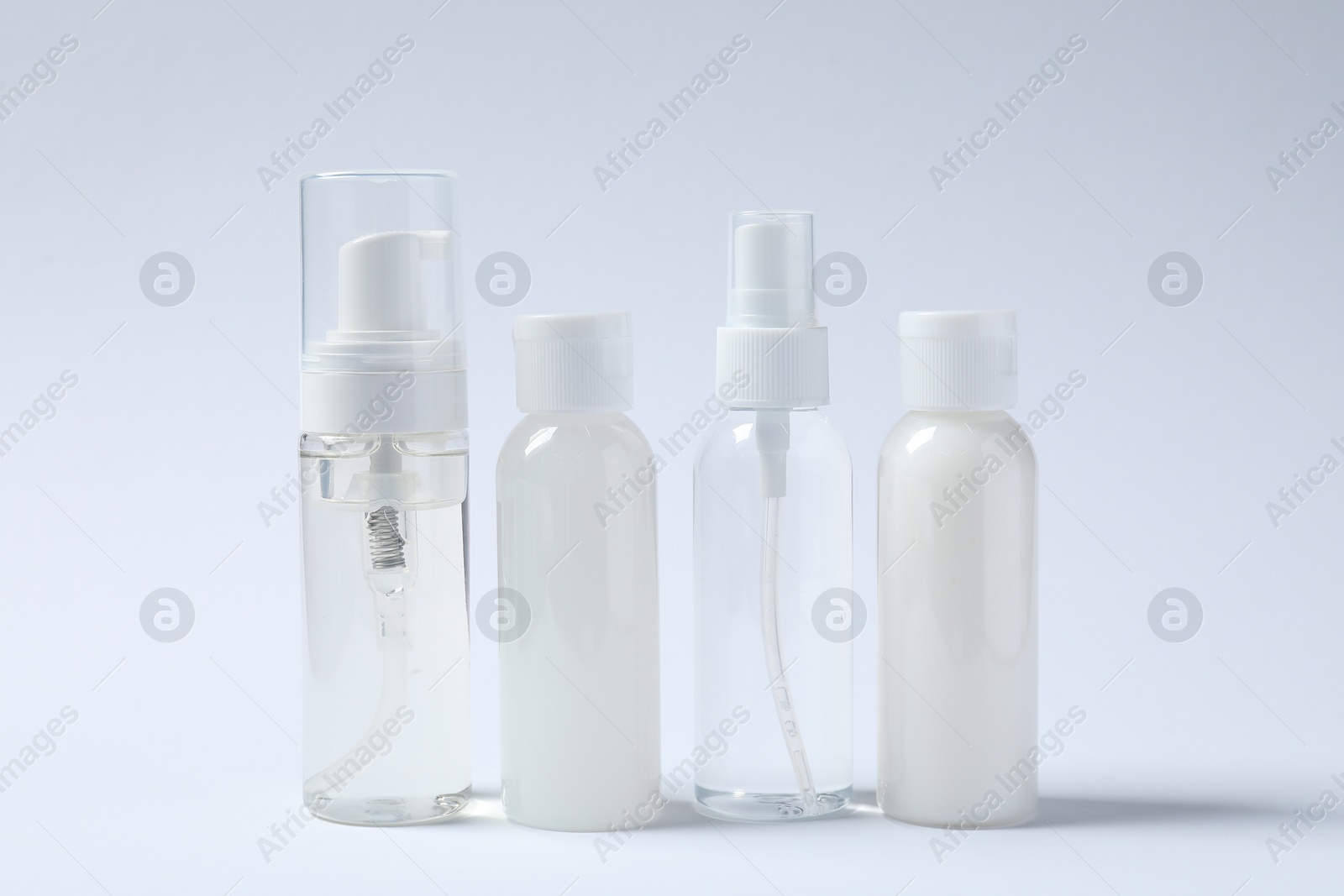 Photo of Cosmetic travel kit on white background. Bath accessories