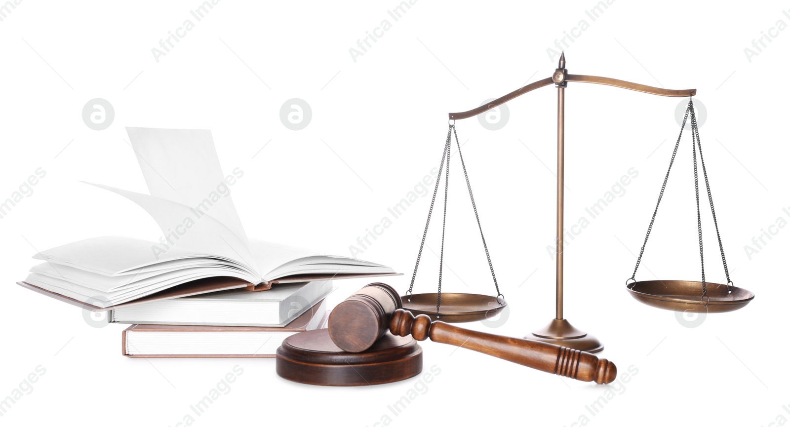 Photo of Wooden gavel, books and scales of justice on white background