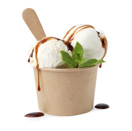 Photo of Scoopsdelicious ice cream with caramel sauce and mint in paper cup isolated on white