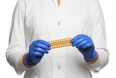 Photo of Doctor holding blister of oral contraception pills on white background, closeup