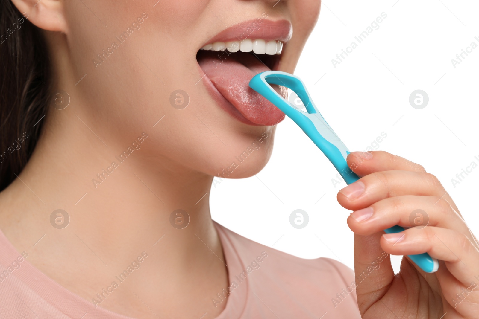 Photo of Woman brushing her tongue with cleaner on white background, closeup