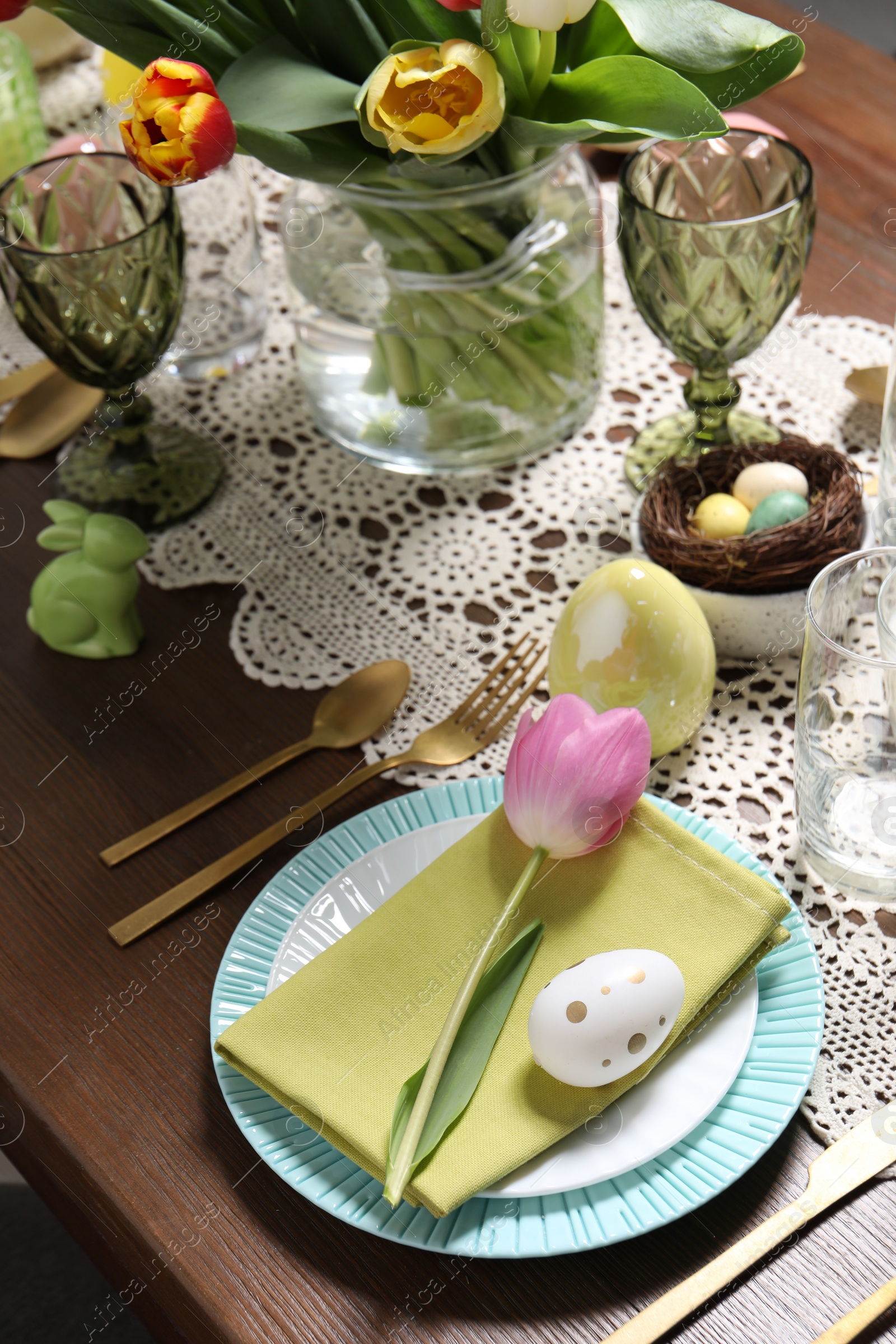 Photo of Festive table setting with beautiful flowers. Easter celebration