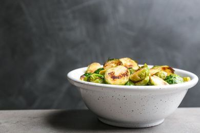 Photo of Roasted Brussels sprouts in bowl on grey table