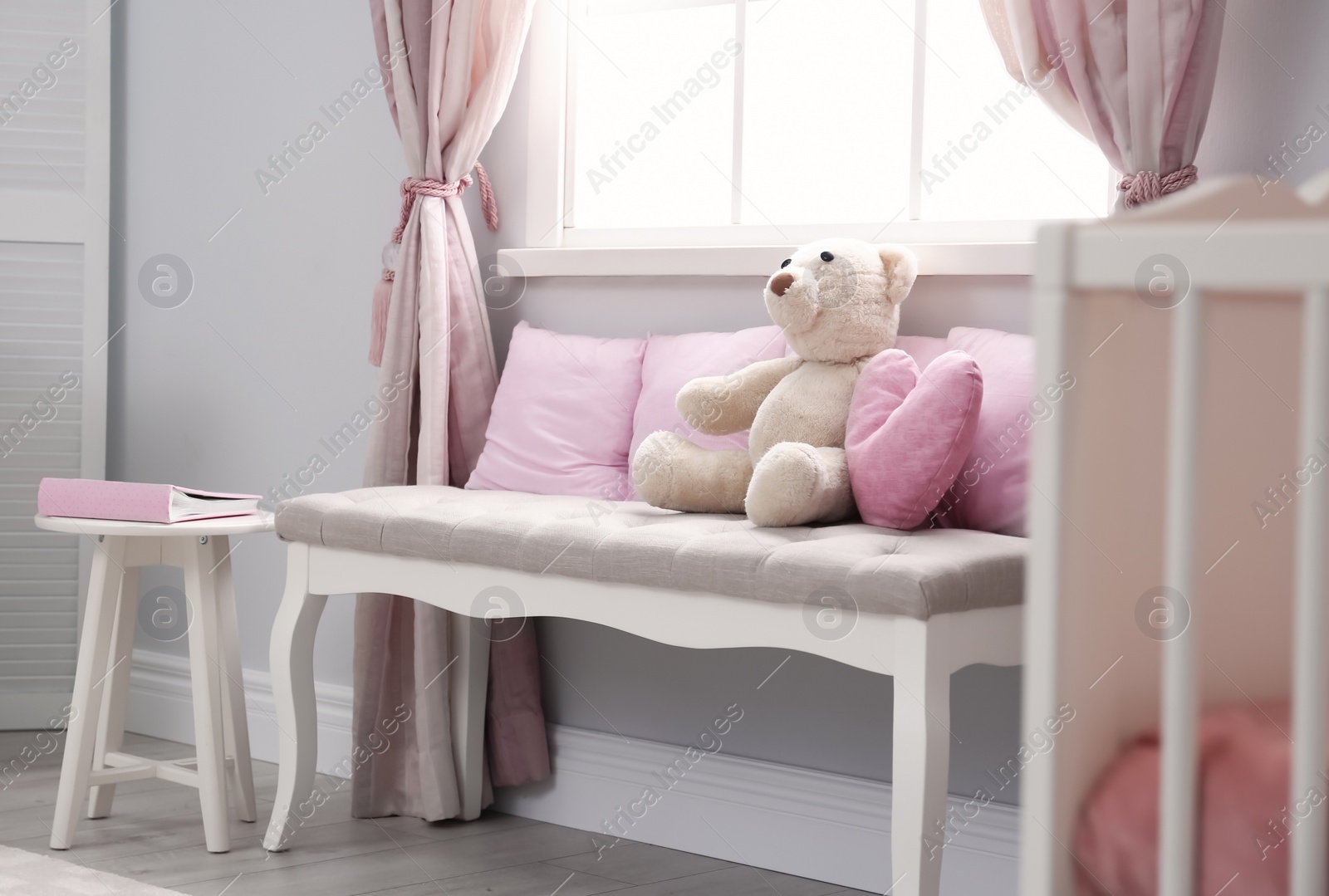 Photo of Baby room interior with indoor bench