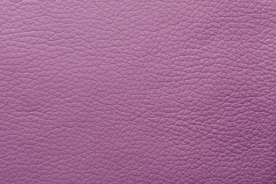 Texture of violet leather as background, closeup