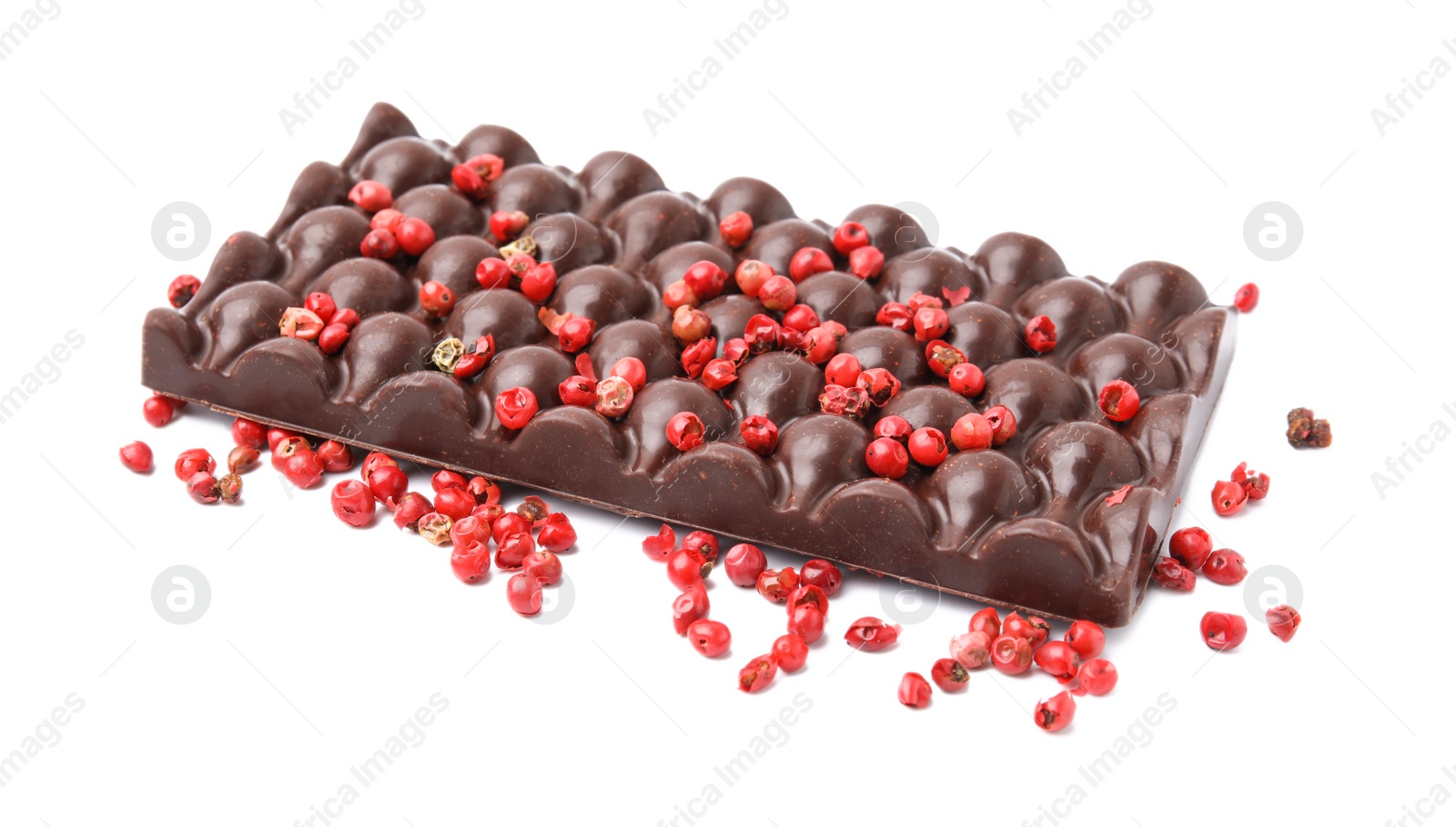 Photo of Dark chocolate bar with red peppercorns isolated on white