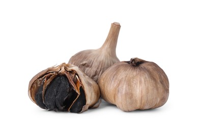 Bulbs of fermented black garlic isolated on white