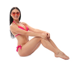 Photo of Beautiful young woman in stylish bikini with sunglasses on white background