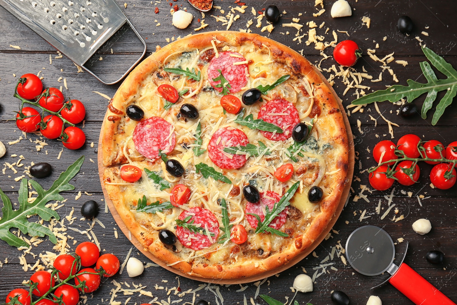 Photo of Flat lay composition with delicious pizza and ingredients on table