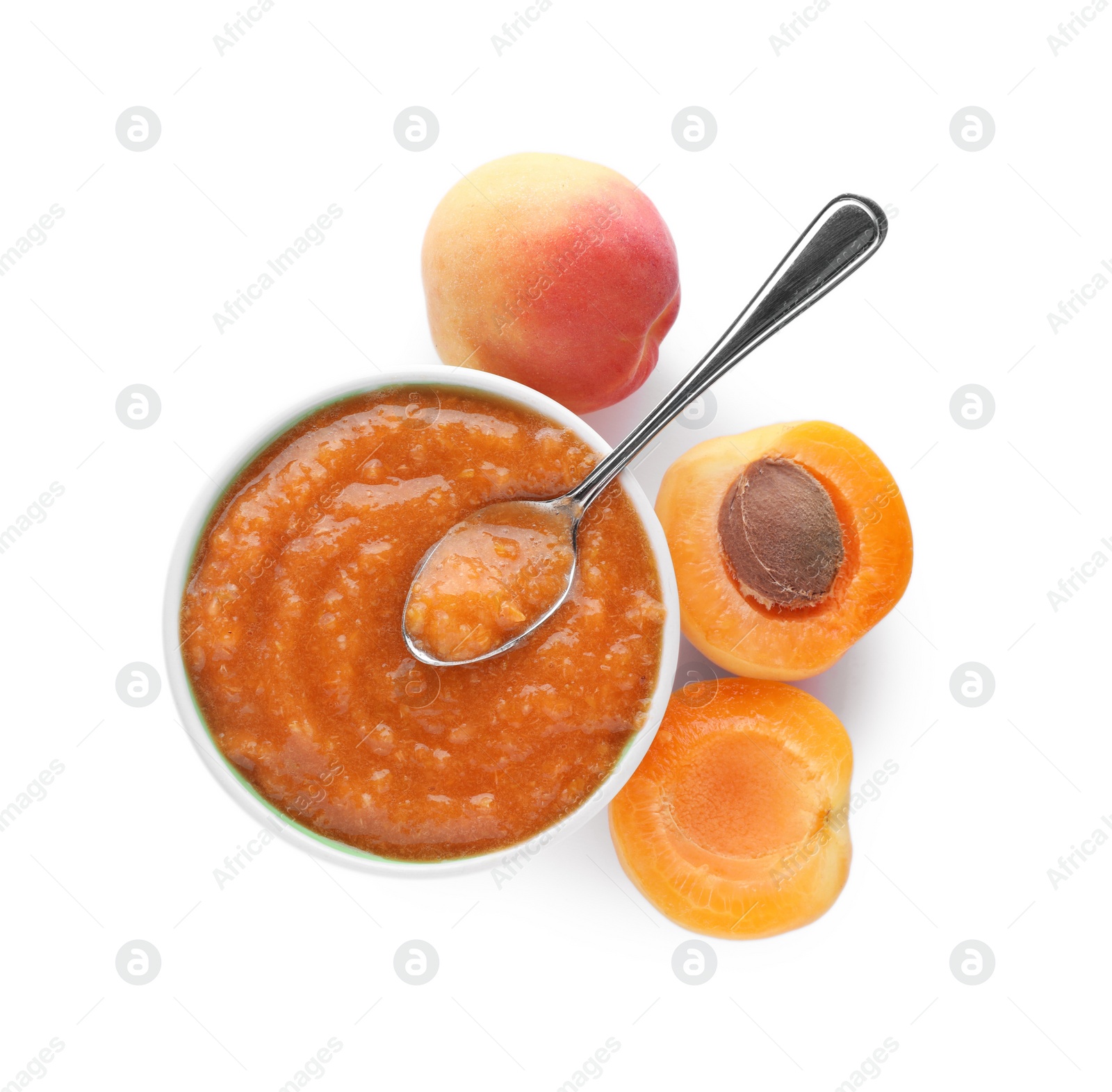 Photo of Apricot puree in bowl and fresh fruits on white background, top view