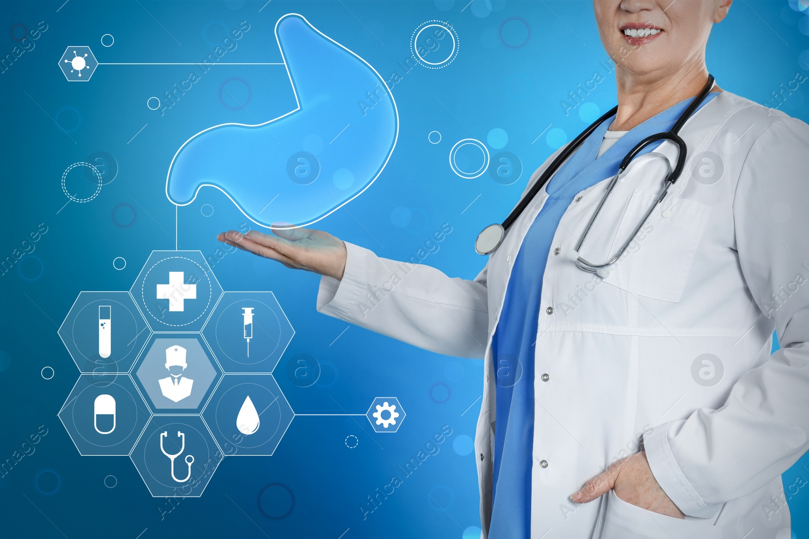 Image of Gastroenterologist holding virtual image of stomach on turquoise background, closeup