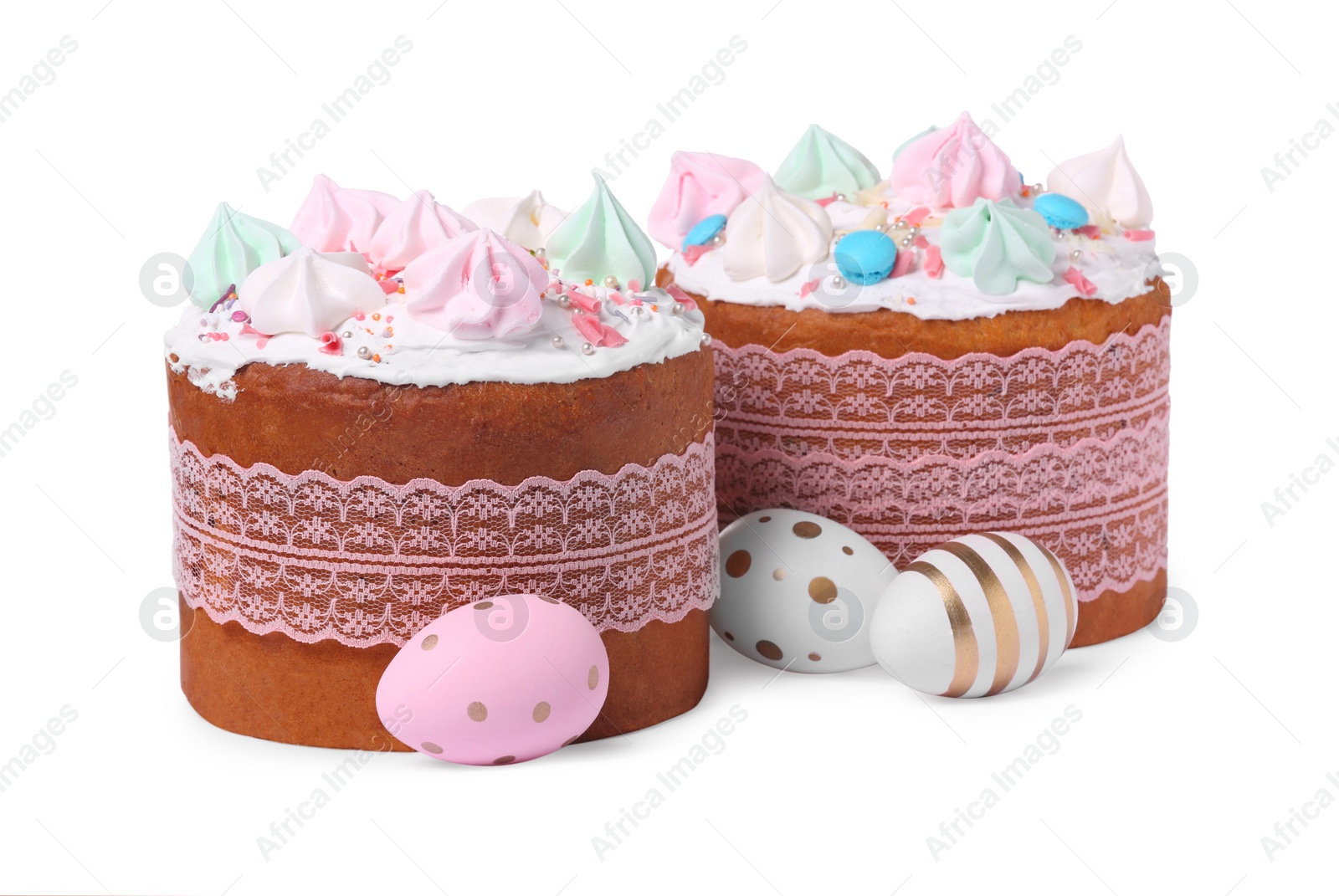 Photo of Traditional Easter cakes with meringues and decorated eggs isolated on white