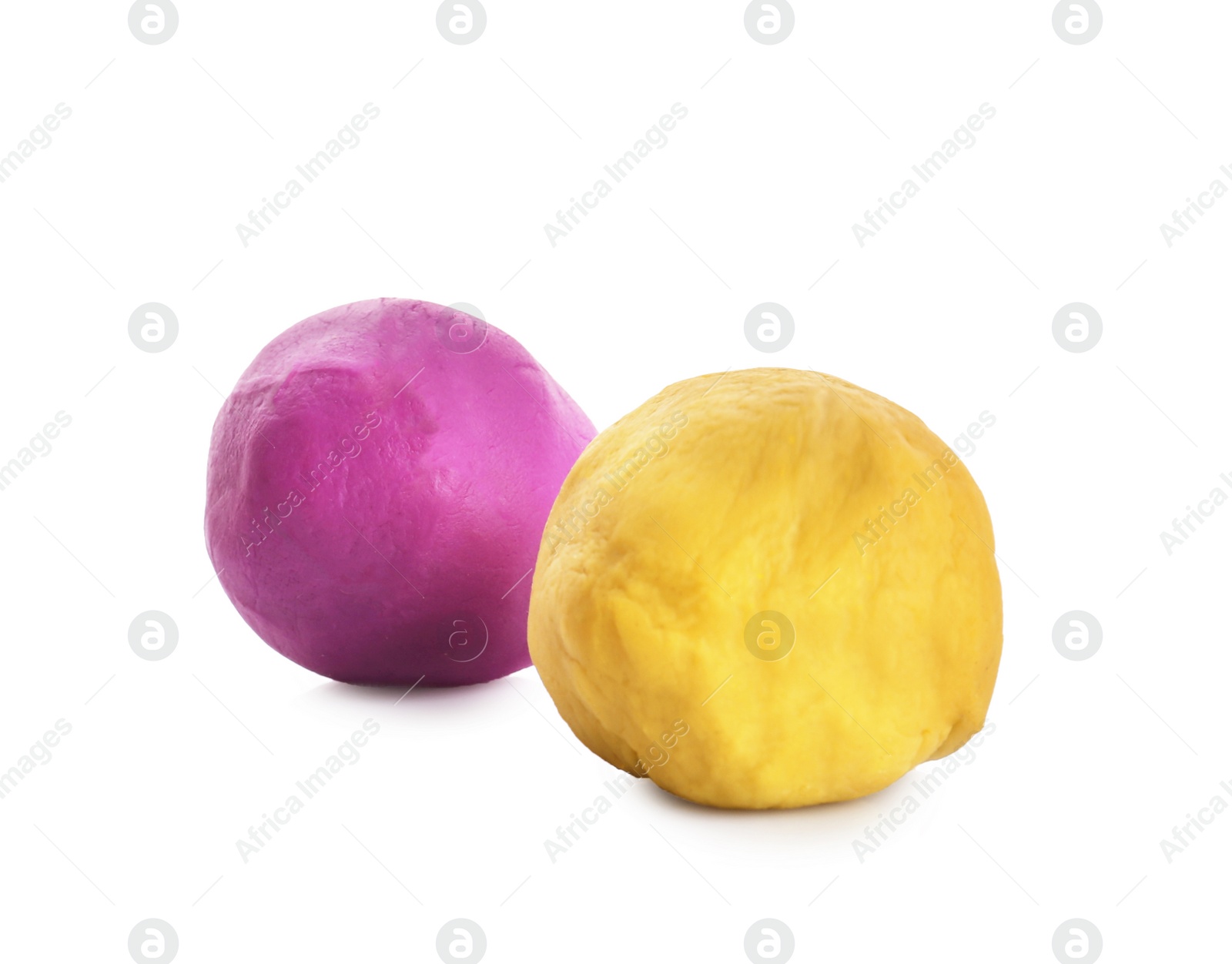 Photo of Colorful play dough on white background