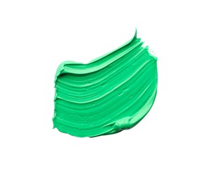Photo of Green oil paint stroke on white background, top view