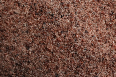 Pile of ground black salt as background, top view