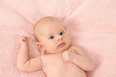 Cute little baby with cream on nose on pink blanket, top view
