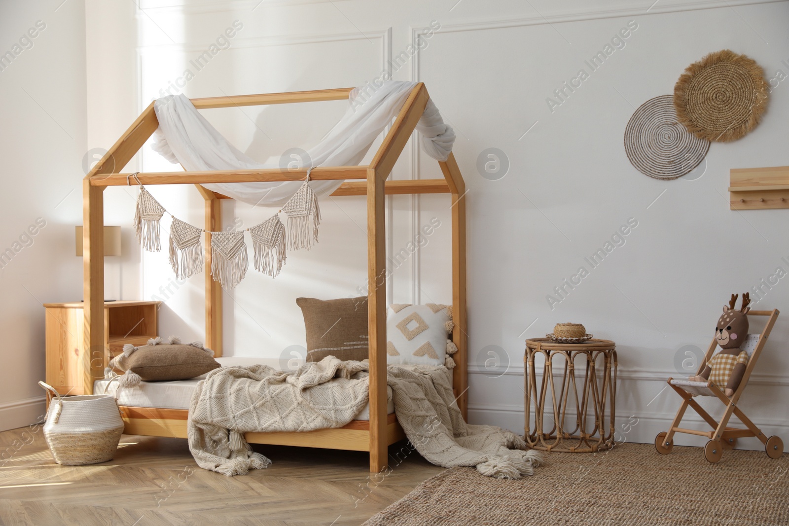 Photo of Stylish child room interior with house bed