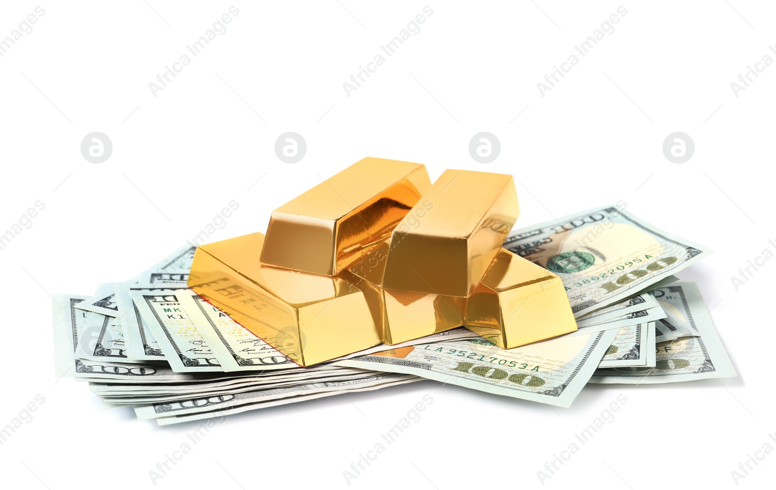 Photo of Shining gold bars and dollar banknotes isolated on white