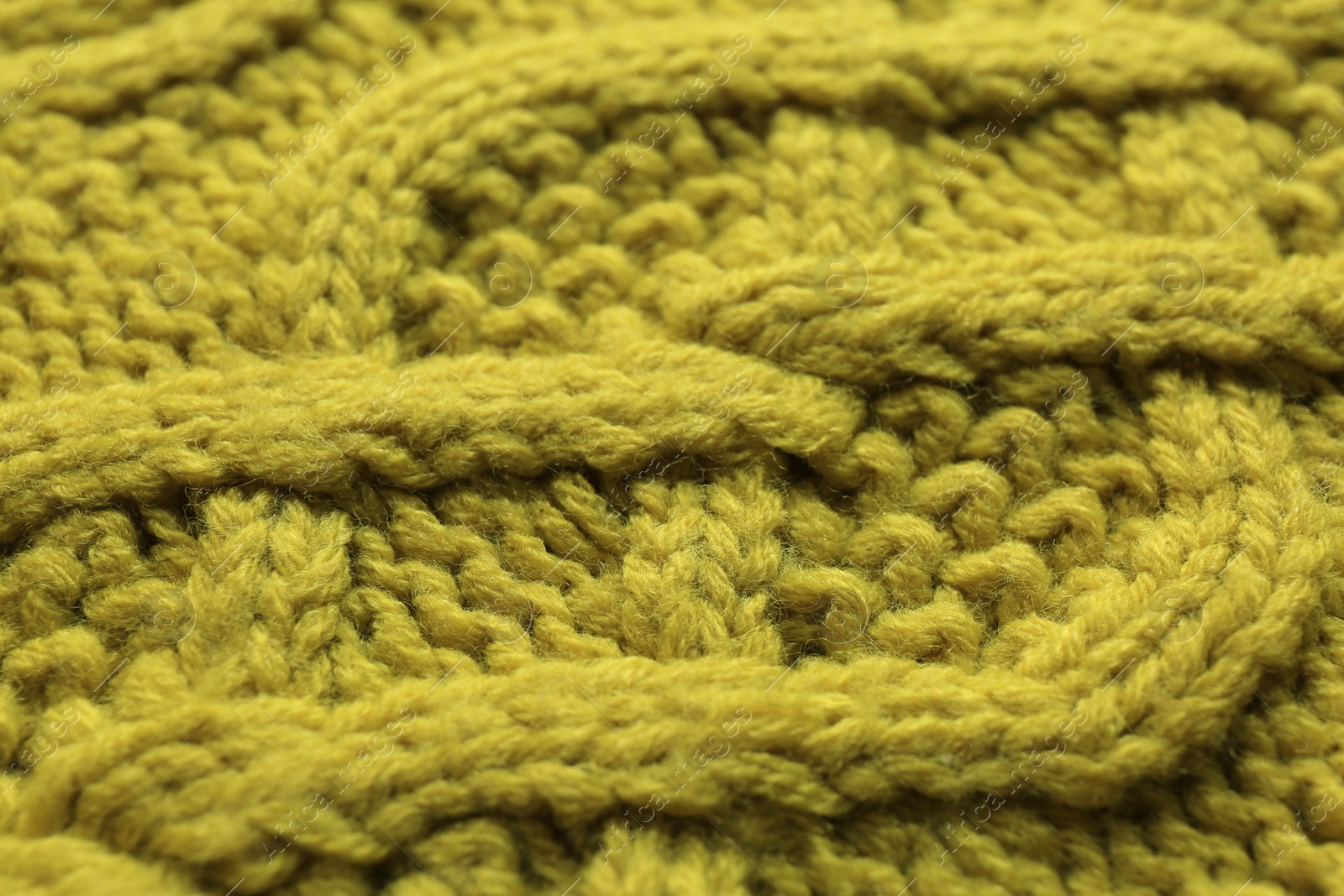 Photo of Knitted fabric with beautiful pattern as background, closeup