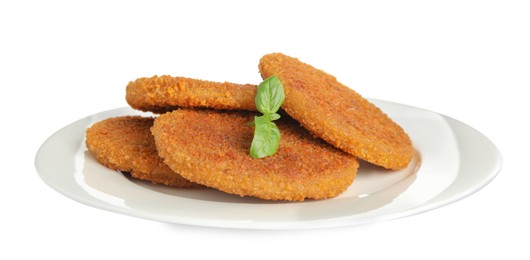 Delicious fried breaded cutlets with basil leaves isolated on white