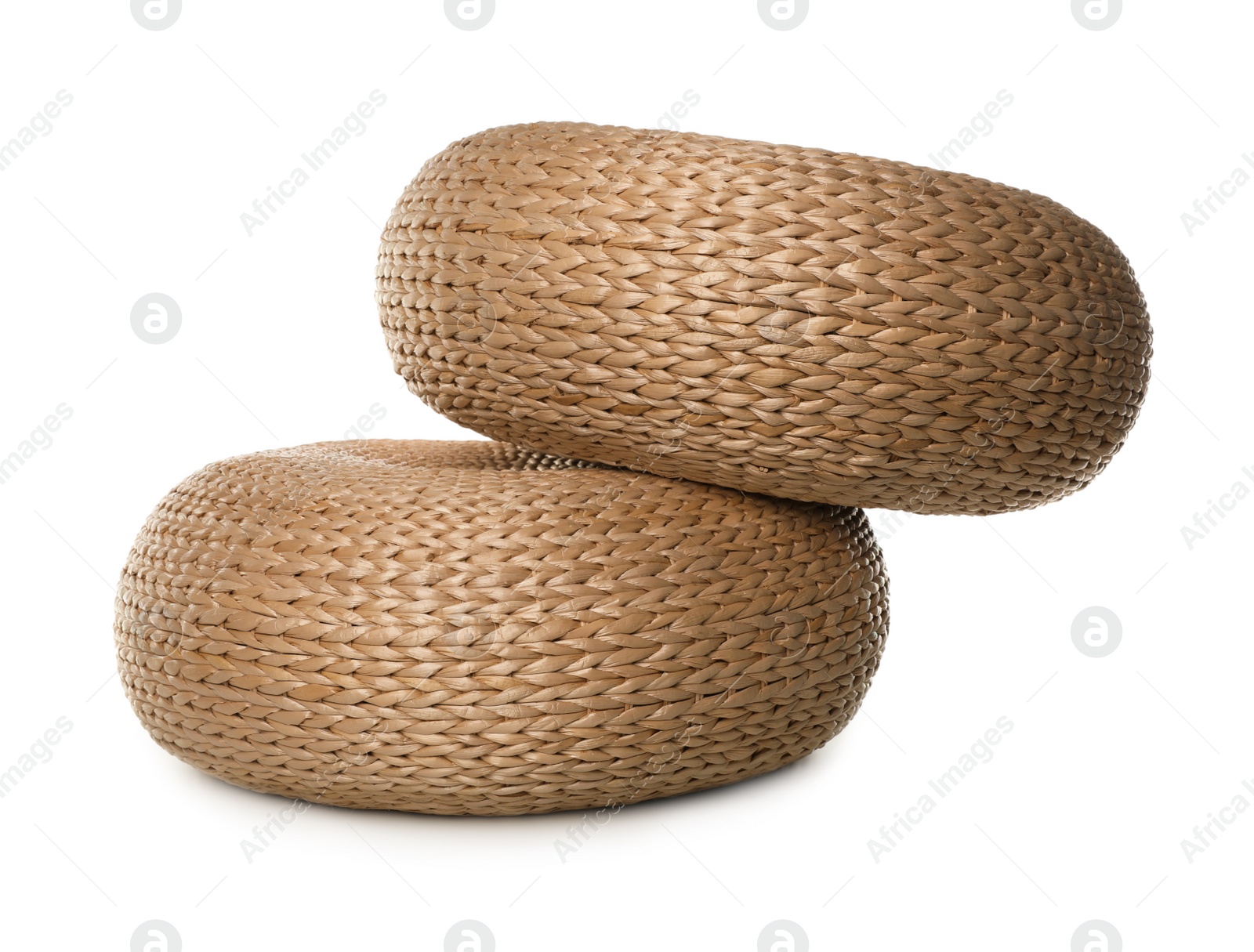 Photo of Two stylish wicker poufs on white background