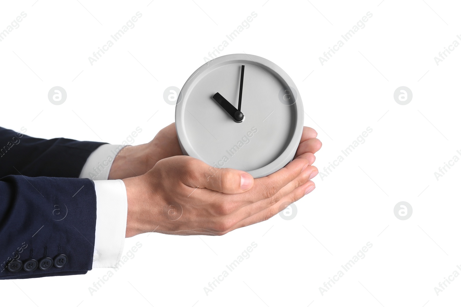 Photo of Businessman holding alarm clock on white background. Time concept