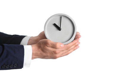 Businessman holding alarm clock on white background. Time concept