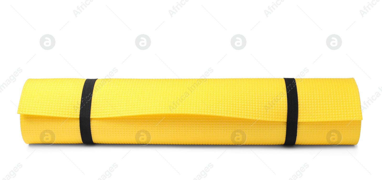 Photo of Yellow rolled mat isolated on white. Camping tourism equipment