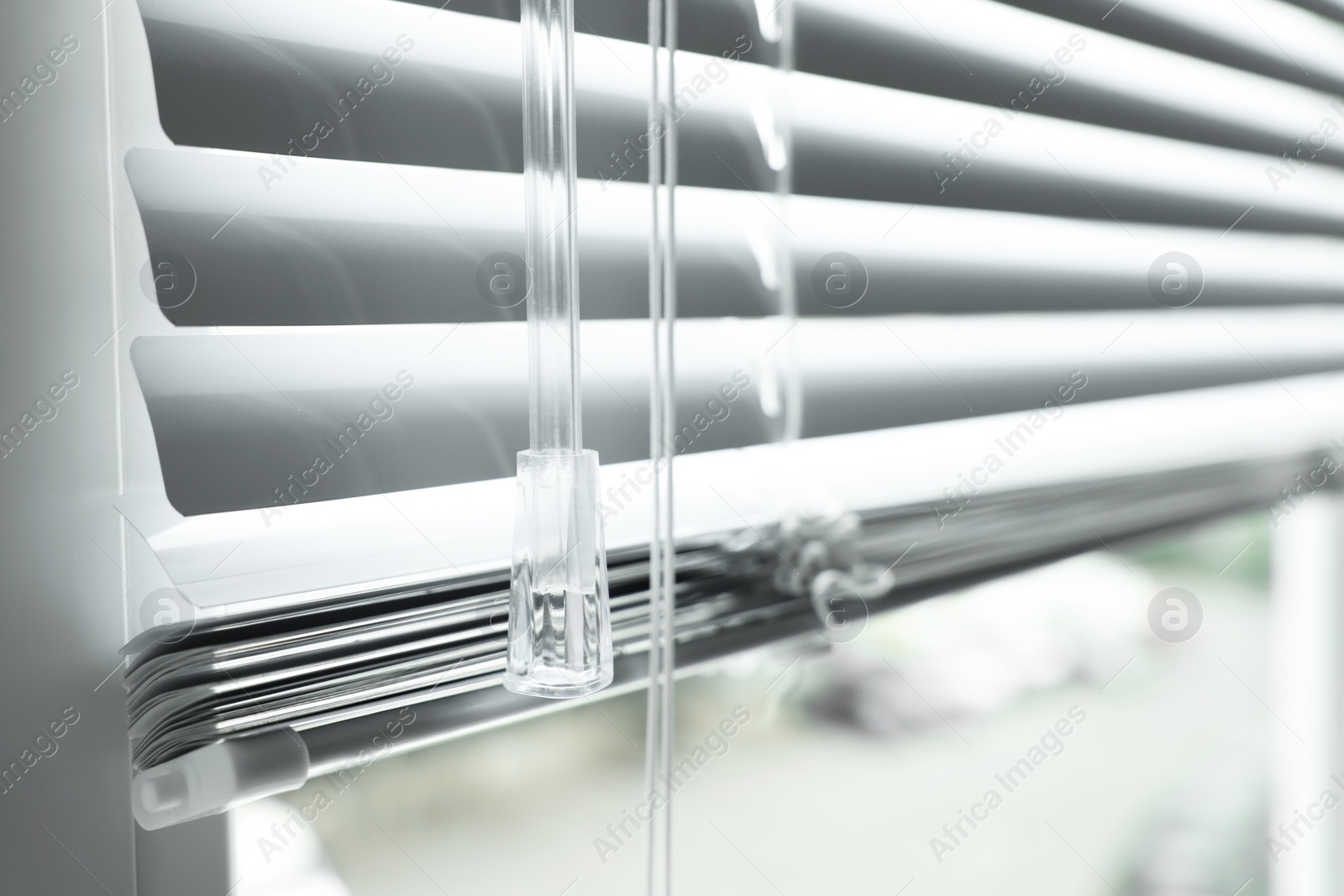 Photo of Closeup view of stylish horizontal window blinds