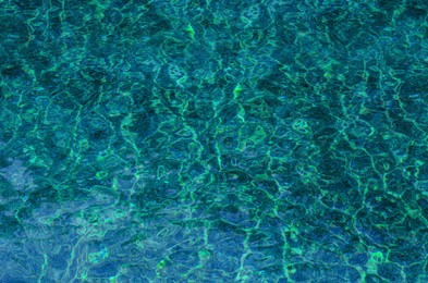 Photo of Clean water with rippled surface as background, top view