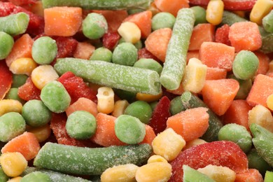 Mix of different frozen vegetables as background, closeup