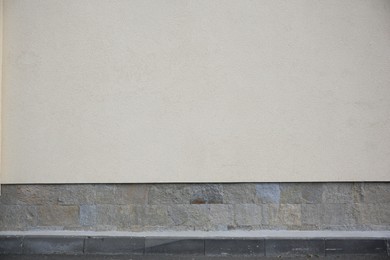 Photo of Beige wall of building outdoors. Exterior design