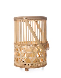 Photo of Stylish wicker holder with candle isolated on white