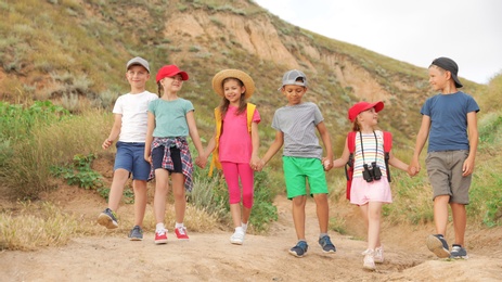 Photo of Cute little children outdoors on summer day. Camping trip
