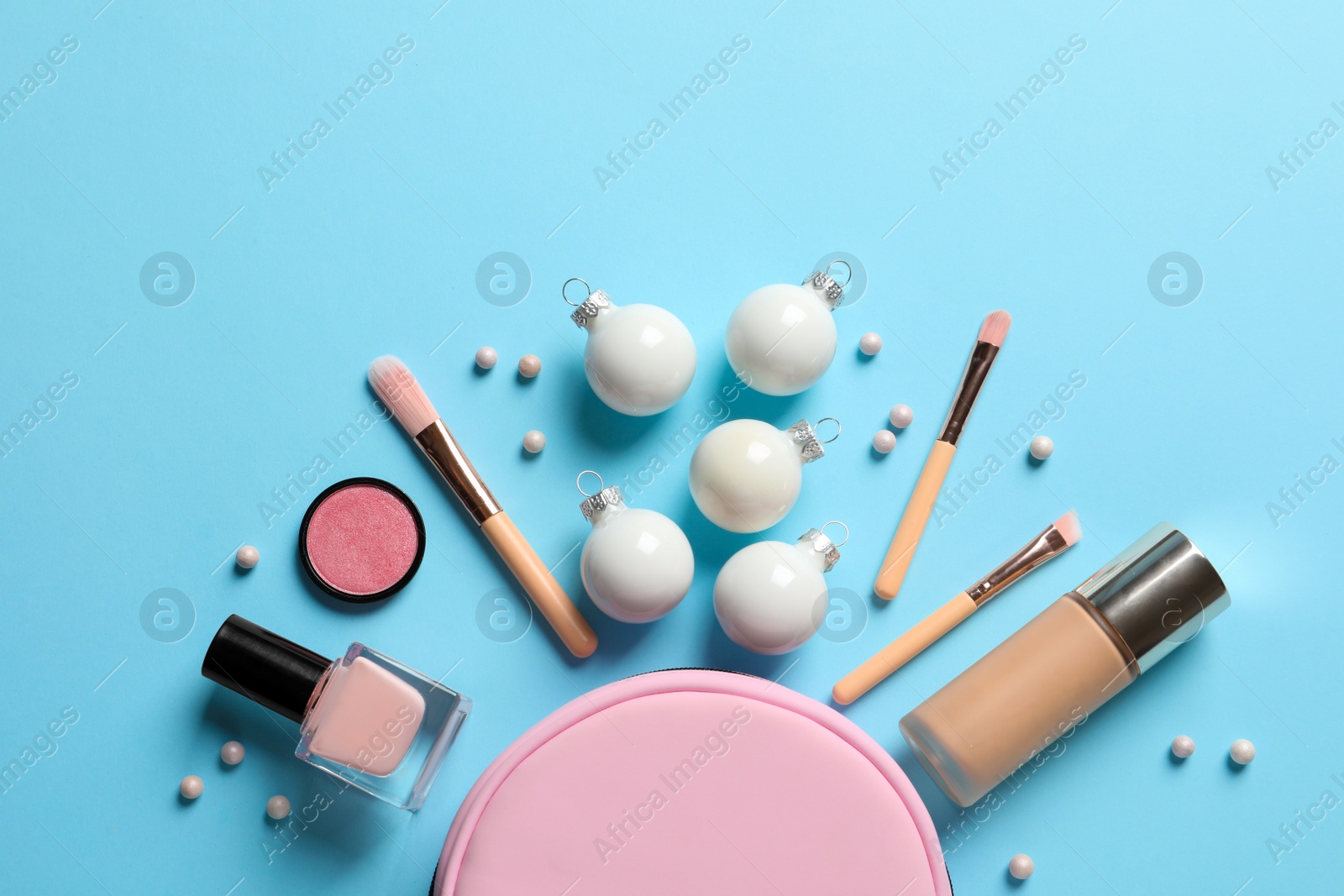 Photo of Flat lay composition with makeup products and Christmas decor on color background