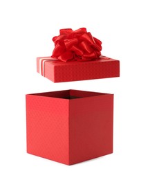 Photo of Red gift box and lid with bow on white background