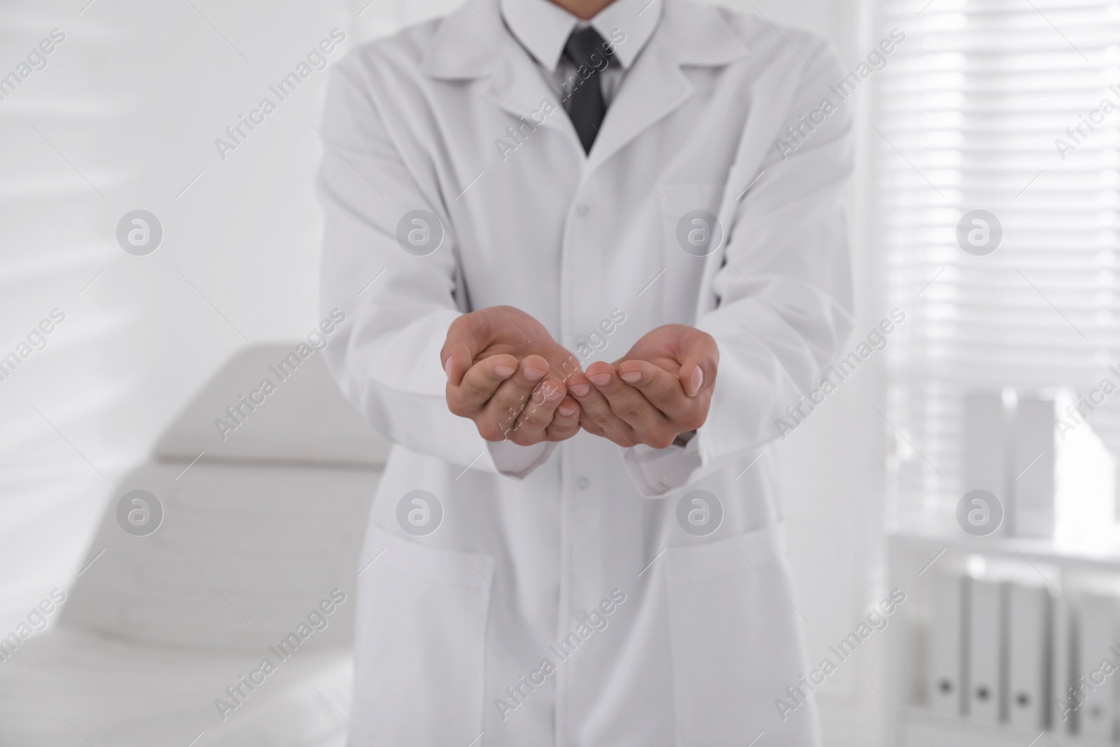 Photo of Dentist holding something in clinic, closeup view