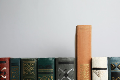 Photo of Collection of old books on light background