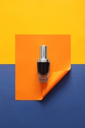 Blank bottle of perfume on color background