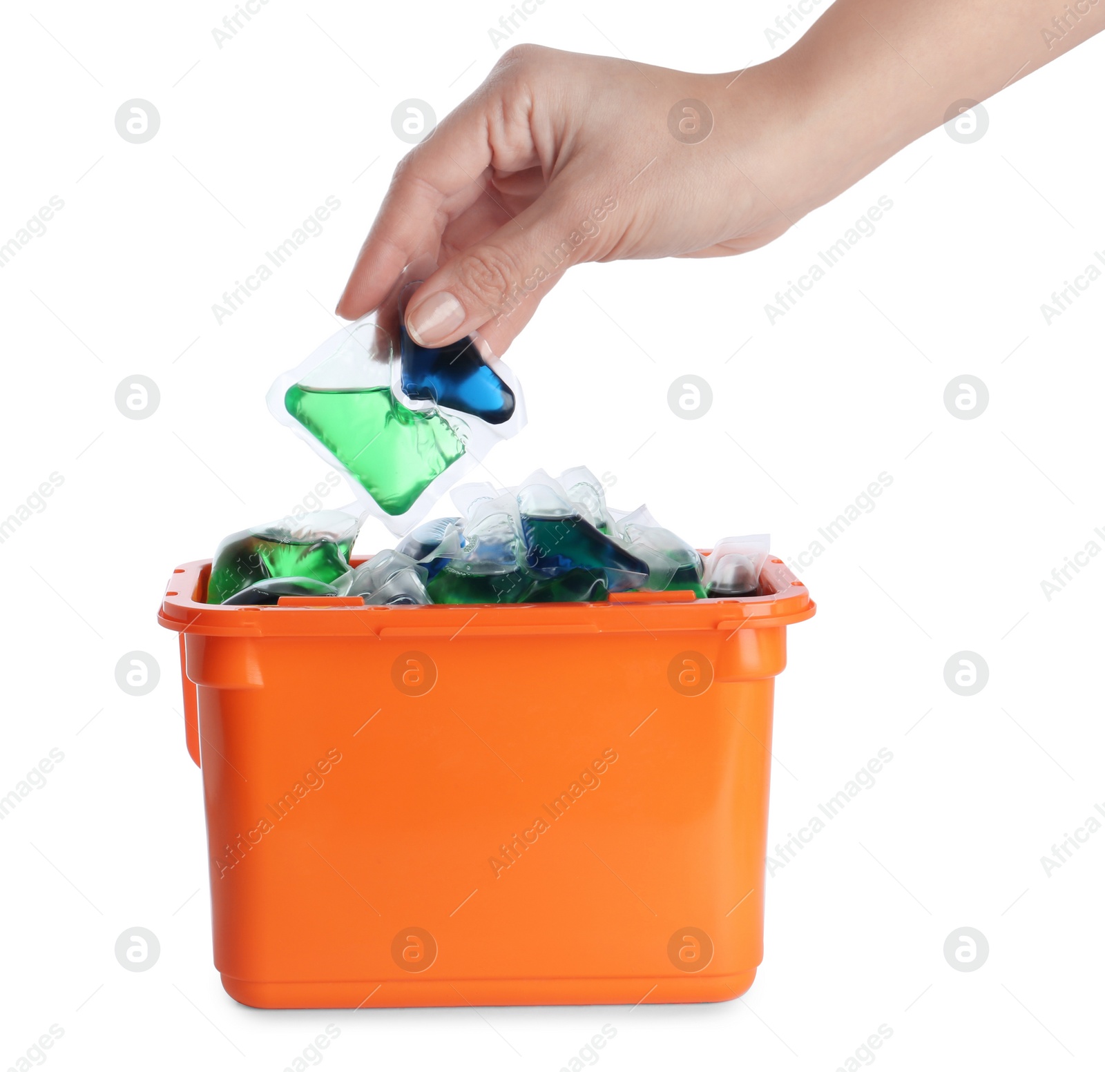 Photo of Woman taking laundry capsule out of box against white background, closeup