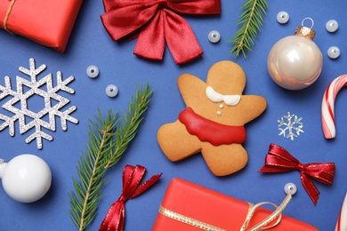 Photo of Flat lay composition with Christmas decor on blue background